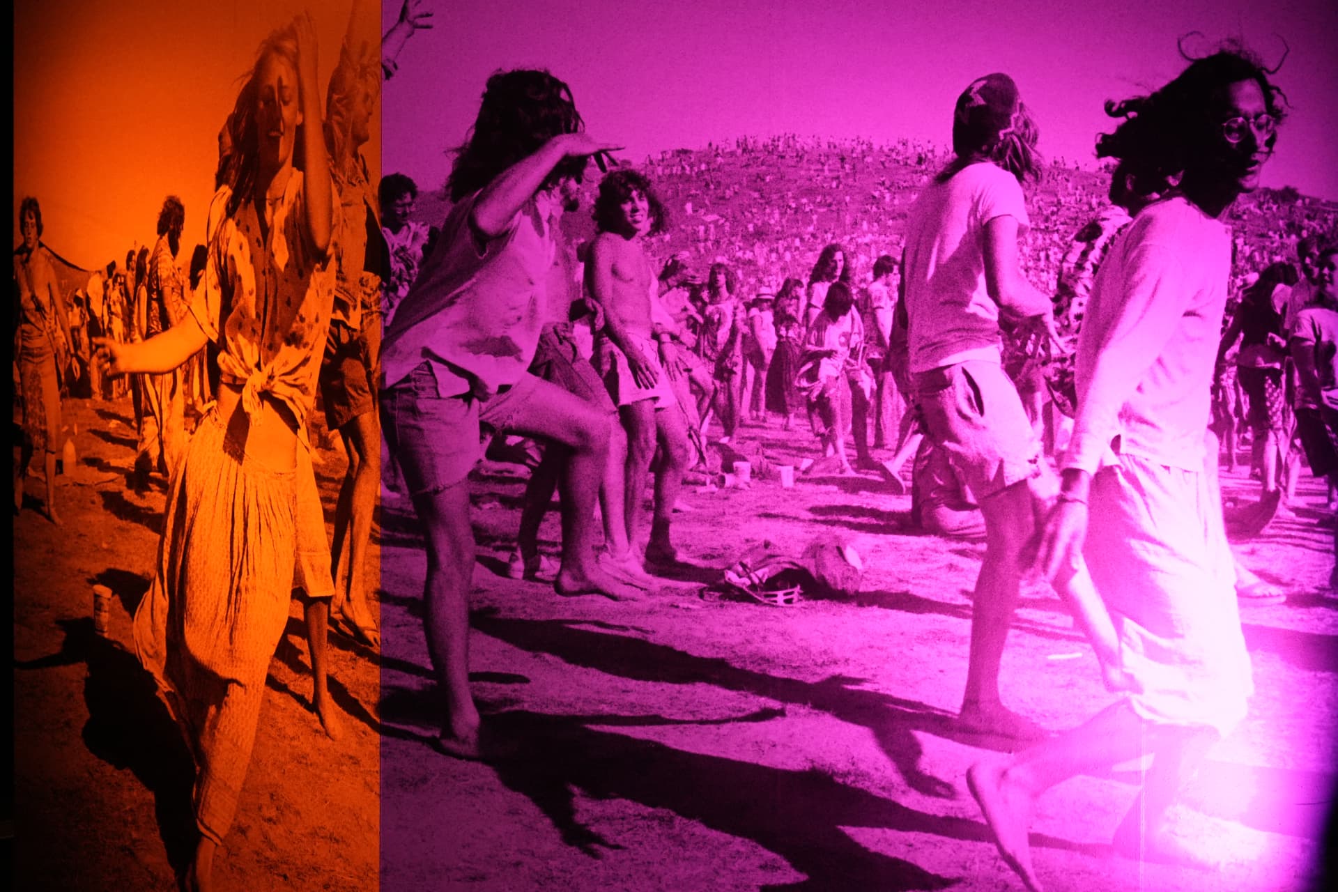 Dancers projected in duotone across the exhibition dance floor