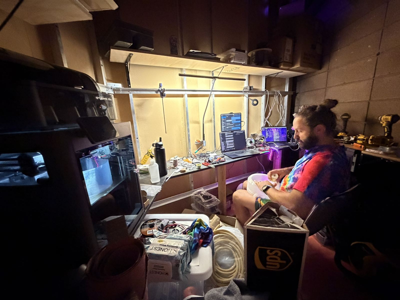 Building a light fixture by hand in the nerd closet, the night before opening